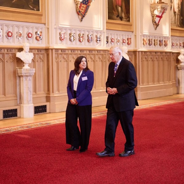The Duke of Gloucester speaking with Canine Partners CEO, Lucy Eldred, at the Windsor Castle event