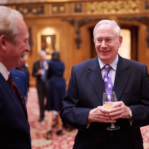 The Duke of Gloucester speaking with guests at the Windsor Castle event