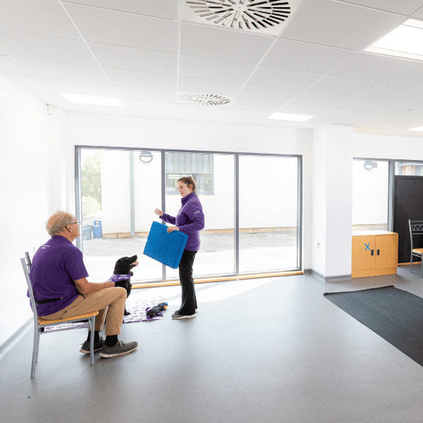 Trainer running a puppy training class at the National Training Centre