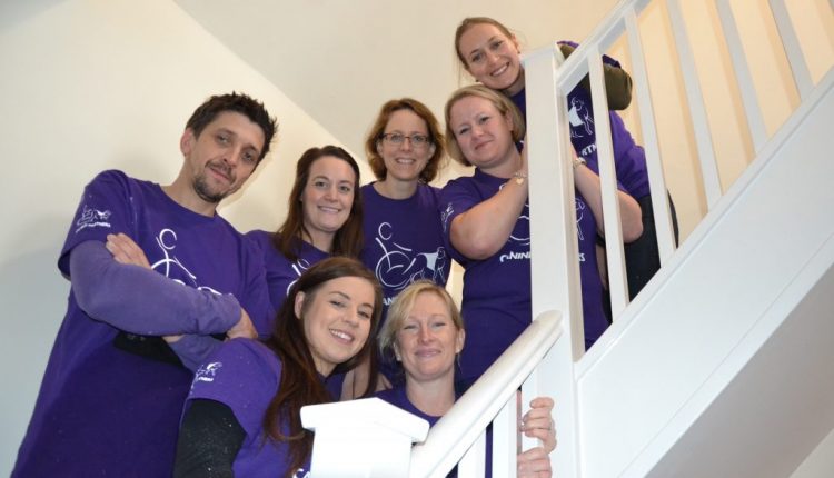 Purina volunteers stood on stairwell