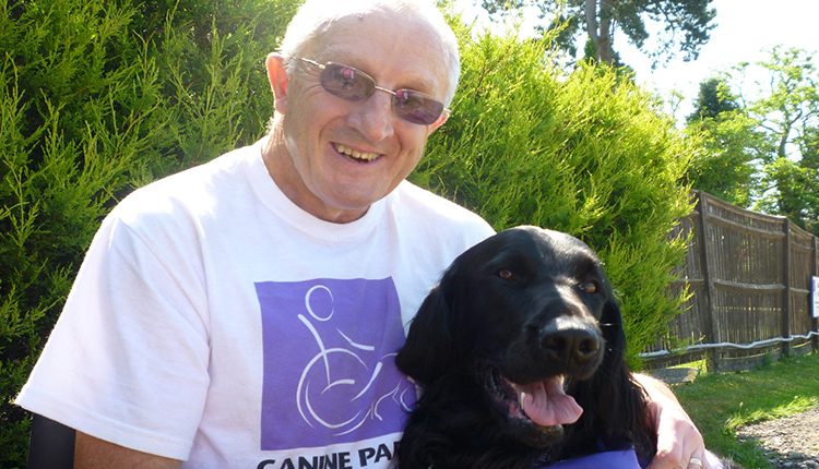 Barry with his canine partner Guy, and assistance dog