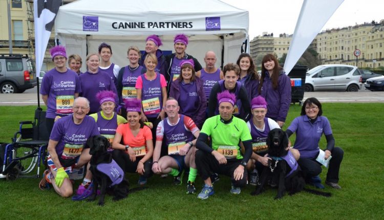 Group shot of Bright10 runners at Canine Partners marquee