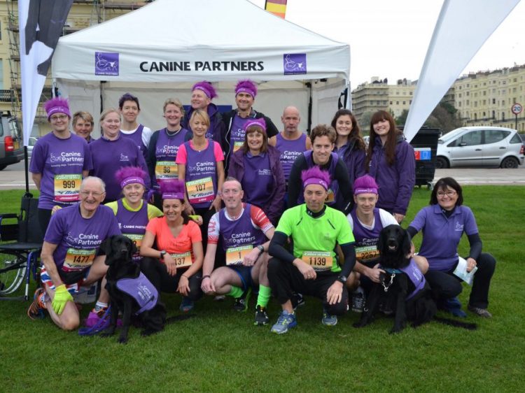 Group shot of Bright10 runners at Canine Partners marquee