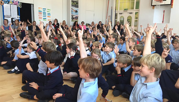 Thomas's School Fulham pupils in assembly