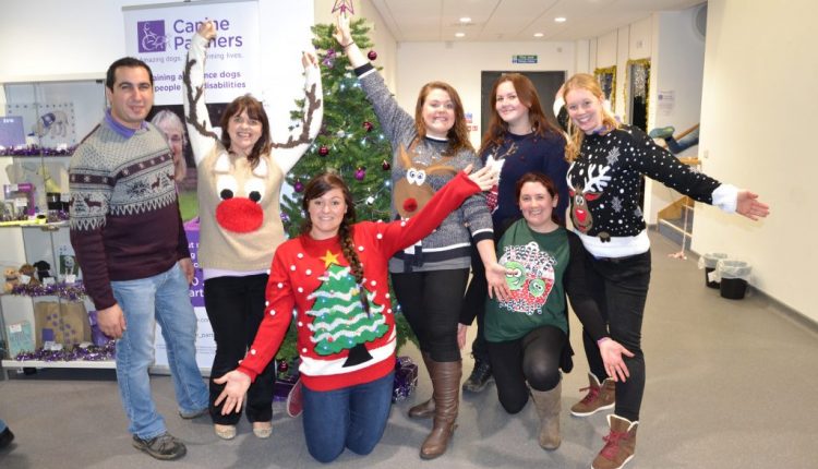 Canine Partners staff at Christmas Evening wearing festive jumpers