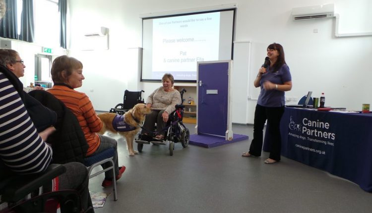 Helen Watkinson of Canine Partners delivering presentation with partnership Pat and Ella