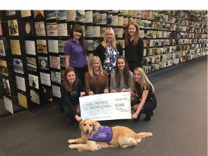 HSBC Canary Wharf team with cheque for £5,000