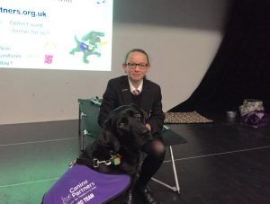 Student at Toynbee School with demonstration dog Yarna