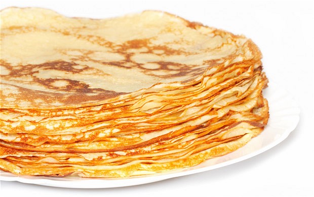 Pile of pancakes on white background