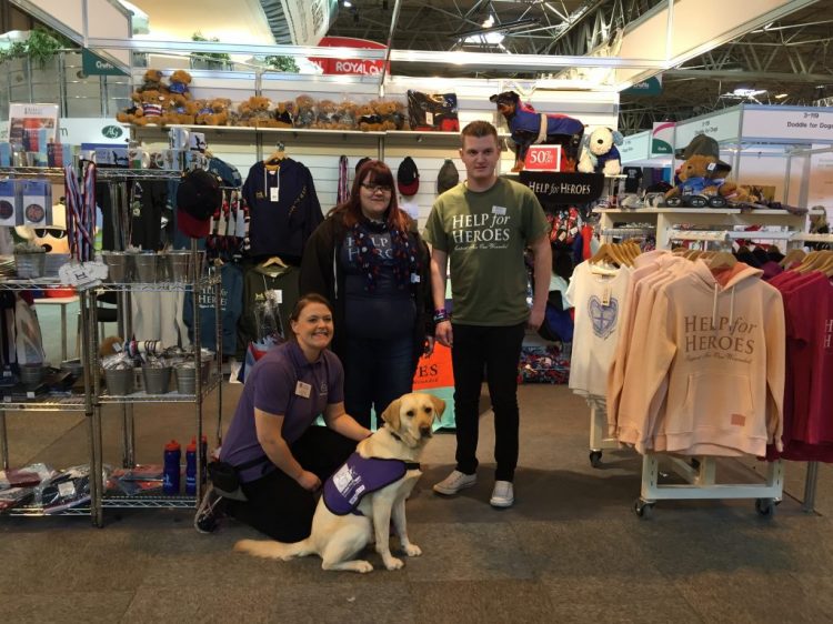 Canine Partners staff member Fiona with Help for Heroes team at Crufts