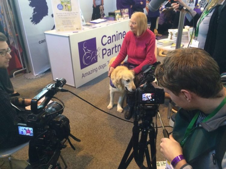 Partnership Wendy Hilling and Teddy with a film crew talking about Canine Partners
