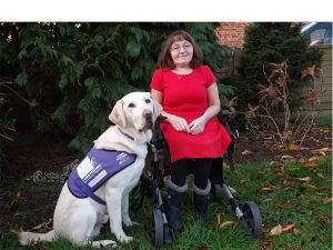 Partner Karen with her assistance dog Gooch