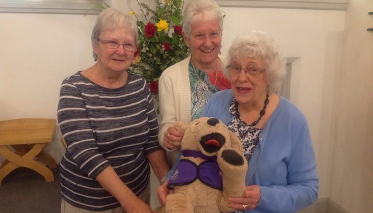 St Annes Fellowship members with Canine Partners stuffed toy