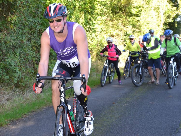 Paralympian Mike Goody cycling at Canine Partners Pedal for Paws event