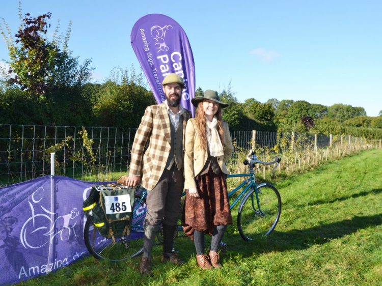 Two vintage dressers with tandem bike at Canine Partners cycling event Pedal for Paws 2016