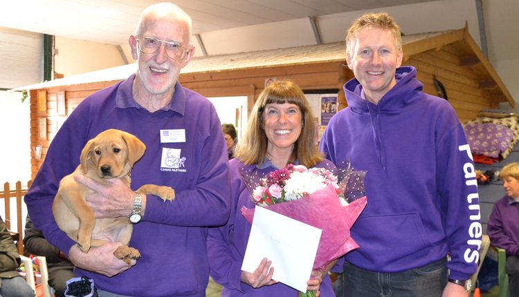 Puppy in training Pixie with Puppy Parent Roger Gould, Satellite trainer Lorraine Lotan and Canine Partners CEO Andy Cook
