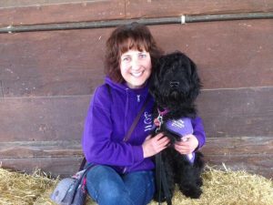 Puppy Parent volunteer Lesley Fisher with assistance dog puppy in training Queisha