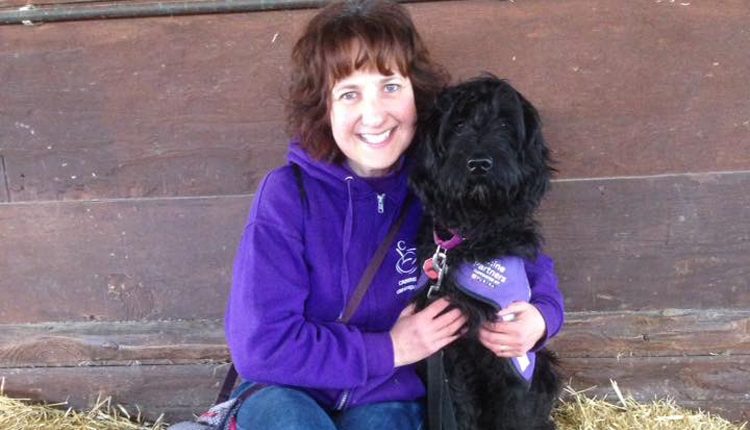 Puppy Parent volunteer Lesley Fisher with assistance dog puppy in training Queisha