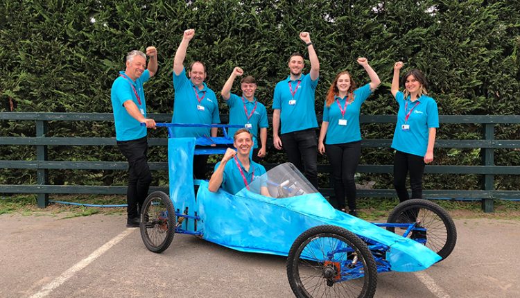 The Insurance Emporium team posing with their Micklegate Soapbox Challenge kart