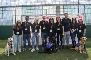 Image of three dogs together with a group of individuals attending the CPR Cup in 2024.
